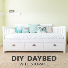 a white day bed with drawers underneath it