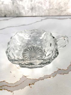 a glass bowl sitting on top of a table