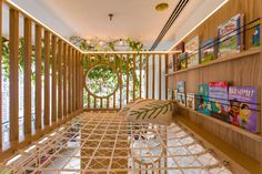 a room with bookshelves and shelves filled with books