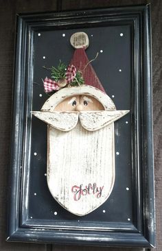 a wooden sign with a santa clause on it