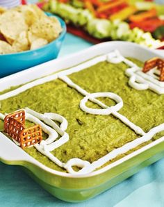 a close up of a tray of food on a table with other foods in the background