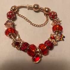 Red & Gold Pandora Bracelet With Lots Of Charms. Also Come With Bag, Cleaning Cloth And Instructions On How To Care For Bracelet. Brand New Never Worn. Gold Pandora Bracelet, Gold Pandora, Pandora Red, Gold And Red, Pandora Bracelet, Bracelet Gold, Pandora Jewelry, Cleaning Cloth, Womens Jewelry Bracelets