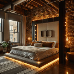 a bedroom with brick walls and lights on the ceiling, along with a large bed