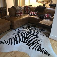 Our zebra print cow hides are finished and inspected in our own workshop to ensure they meet our strict standards. Our zebra print cowhides offer a luxurious and stylish look. weather its to place on the floor, drape over your favourite sofa or even as a wall hanging, our cow hides are sure to add style and fashion to any area. Our sales team can be contacted at anytime to advise on any cow hide situation, a service that is just not available from other retailers. Please remember that these are Hide Rug, Cow Hide Rug, Cow Hide, On The Floor, Zebras, Zebra Print, Animal Print Rug, Not Available, Cow