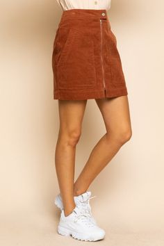 You'll be looking all kinds of 'cordially' fashionable in this Corduroy Mini Skirt In Rust Brown! Look lux in this comfy and chic skirt - made of high-quality corduroy and featuring a rust brown hue, you're sure to stand out in style. So let's get 'corduroy' underway! High-Waisted Fit A-Line Short Length Button Closure Exposed Front Zipper Front Patch Pockets Back Welt Pockets Soft Corduroy Unlined 100% Cotton Hand Wash Cold, Lay Flat to Dry Imported Small: Length 17" Waist: 27" Medium: Length 1 Navy Corduroy Skirt Outfit, Casual Corduroy Mini Skirt With Pockets, Corduroy Lined Skirt Bottoms For Fall, Casual Corduroy Skirt With Pockets, Casual Corduroy Mini Skirt, Brown Corduroy Casual Mini Skirt, Casual Brown Corduroy Mini Skirt, Casual Brown Corduroy Skirt, Brown Corduroy Mini Skirt For Fall