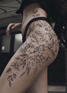 a woman's thigh with flowers on it