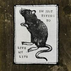 a patch with a rat on it that says i'm just trying to live my life