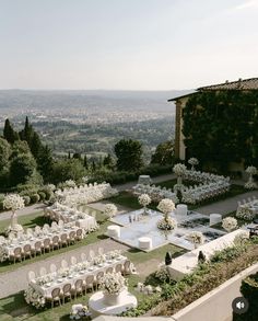 an aerial view of a wedding venue with tables and chairs set up for the guests