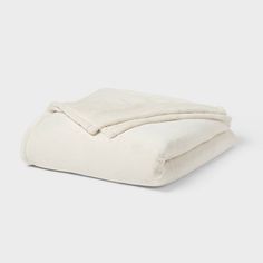 a white blanket folded on top of each other