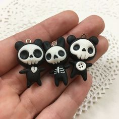 three little black and white panda bear charms