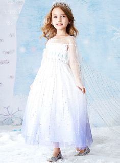 Do not miss out on the beautiful dresses from Kemedress.com and get one for your little princess as soon as possible. The long flower dress will look beautiful on your young princess and will make her feel like a real-life fairy. The white color of the dress transforms into blue at the bottom of the dress creating an attractive aura. A see-through scoop neckline and see through long length sleeves form the bodice of the dress. it also further decorated with sequins that sparkle bright. The dress has a tulle cape at the back for the princess feels. Long Sleeve Flower Girl Dress, Long Flower Dress, Tulle Cape, Red Ball Gown, Long Flowers, Layered Tulle Skirt, Strapless Sweetheart Neckline, Blue Tulle, White Tulle