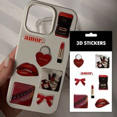 a person holding up a phone case with various stickers on it and an assortment of lipstick