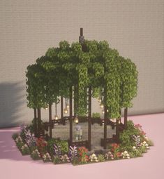 a miniature model of a park with trees and flowers