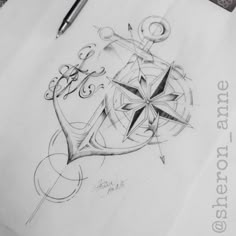 a pencil drawing of an anchor and compass