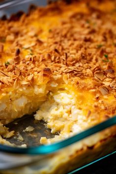 a casserole dish filled with food and topped with coconut crumbled toppings