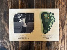 an old photo of a man playing golf on a wooden background with the words monroe golf club written in black and white