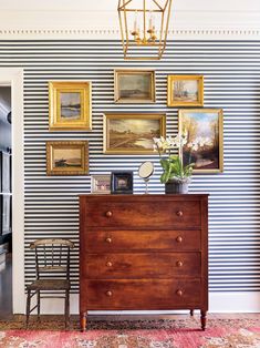 the blue and white home is featured on this page, with pictures hanging above it