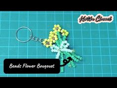 bead flower bouquet keychain made with beads and plastic beads on a blue background