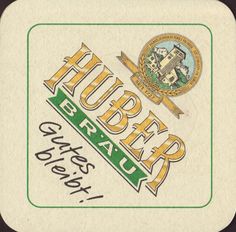 a close up of a label on a paper with the words huber beer and an image of a building