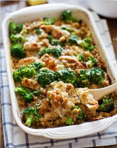 a casserole dish with chicken and broccoli in it on a table