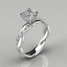 a white gold engagement ring with diamonds on it