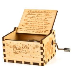 a wooden music box with the words class of 2012 engraved on it's lid