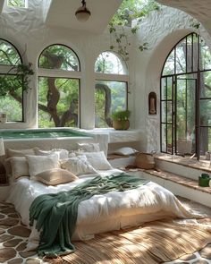 a bedroom with large windows and a jacuzzi tub in the middle of it