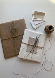 the wrapping paper is tied up and ready to be wrapped in twine with some lavender sprigs