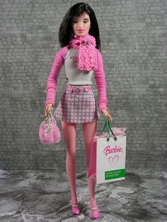 a barbie doll holding a shopping bag and wearing pink tights with her hands in her pockets