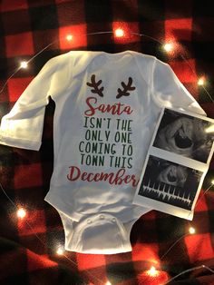 a baby's bodysuit that says santa isn't the only one coming to town this december