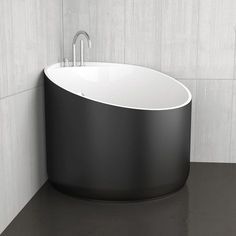 a black and white bath tub in a bathroom