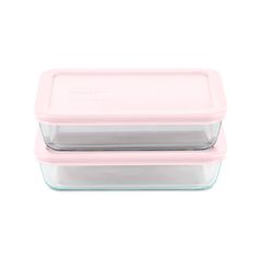 two rectangular glass containers with lids on white background, one is pink and the other is clear