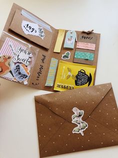 an open brown envelope with stickers on it