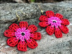 Add a touch of vibrant elegance to your look with these handmade beaded flower earrings. Each pair features a unique blend of colors, from deep blues to warm oranges and pinks, inspired by the beauty of nature. Perfect for any occasion, these earrings are lightweight and versatile, making them an ideal accessory for both casual and formal outfits. Whether you're looking to brighten up your wardrobe or searching for a thoughtful gift, these floral earrings are sure to make a statement.🌼🌸 Featur Coral Beaded Earrings For Gifts, Adjustable Red Flower Beaded Earrings, Red Handmade Flower Earrings, Multicolor Beaded Flower Earrings With Flower Charm, Handmade Pink Beaded Flower Earrings, Multicolor Flower-shaped Beaded Earrings With Flower Charm, Multicolor Flower Shaped Beaded Earrings With Flower Charm, Red Dangle Flower Earrings With Colorful Beads, Handmade Pink Flower Earrings With Round Beads