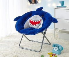 a child's chair with a stuffed shark on it