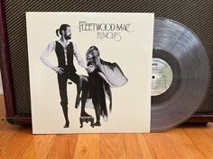 a vinyl album with an image of a man and woman standing next to each other