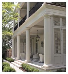 a large white house with columns and balconies