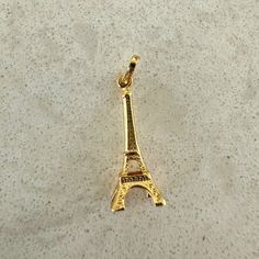 Stylish 14K Gold Paris Eiffel Tower Charm Embrace the enchanting spirit of Paris with our exquisite 18k yellow gold Eiffel Tower charm, a stunning piece that captures the essence of one of the world's most beloved landmarks. This intricately designed 3D charm showcases the Eiffel Tower in all its glory, making it an ideal accessory for anyone who cherishes French culture or has a special connection to the City of Light. Whether you’re looking to commemorate a memorable trip to Paris or simply wa 3d Eiffel Tower, Gold Eiffel Tower, Jewelry Gift Guide, Love Paris, Candy Necklaces, Trip To Paris, Tower Design, French Culture, Paris Eiffel Tower