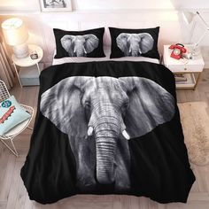 a bed with an elephant on it and two pillows next to the head of another elephant