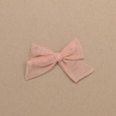 "Pink Tulle Bow Bows are approximately 3.5\" wide by 2.5\" tall. They are made out of tulle fabric. Each bow is cut, sewn, ironed, and attached to either a nylon headband or an alligator clip with a small amount of glue making them durable and wearable for your precious little girl. Bows are handmade to order so there is a production time of 2-3 days before your bows are shipped.  Please contact me with any questions, special orders, custom orders, or new ideas for bows!  Thank you!!" Les Arcs, Tulle Bow, Toddler Hair Bows, Tulle Bows, Pink Tulle, Baby And Toddler, Nylon Headbands, Tulle Fabric, Toddler Hair