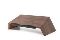 a wooden table with black metal legs and a wood top on it's side