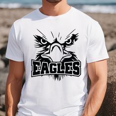 Title: Eagles Mascot Shirt, Eagles Team Shirt, School Mascot Tee, Back to School, Eagles School Pride Tee, Eagles T-Shirt, School Spirit Team Shirt, Big Size, Long Sleeve Tee, Unisex V-Neck, Women's Tank, Youth, Toddler, Baby suit DESCRIPTIONS! * One-sided printing is included in the price. * Please contact us if there is a color that you cannot find in the list. * - We have 3 different tshirt brand that we use, if you only want one particular brand please ask the seller for availability, if you Eagle Pride School Shirts, Eagle Shirt Design School Spirit, School Team Shirts Spirit Wear, Elementary School Spirit Shirts Eagles, Eagles Shirt Design School Spirit, Team Sport Shirt Design, School Pride Shirts, School Sports Shirts