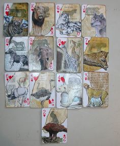 playing cards with different animals on them are arranged in the shape of a heart and surrounded by numbers