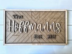 a wooden sign that says the hoffman's est 2012 hanging on a wall