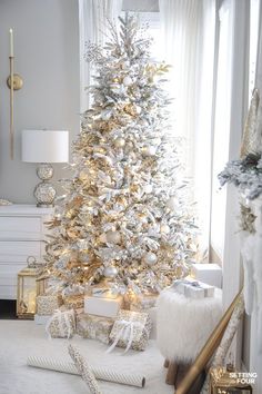 a white christmas tree in a living room