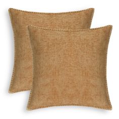 two brown pillows with fringe trims on the front and back, one is made from linen