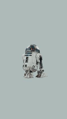 a robot that is standing up against a gray background with the words star wars written on it