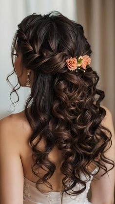 a woman with long brown hair and flowers in her hair, wearing a wedding dress