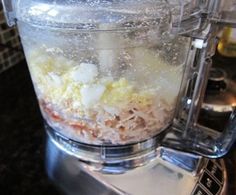 a blender filled with food on top of a counter