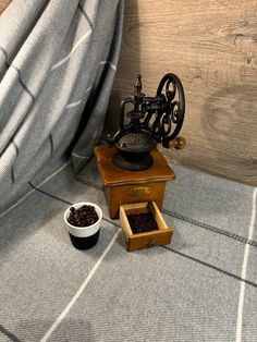 a coffee grinder sitting on top of a wooden table